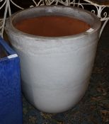 A large white glazed garden planter, 59cm diameter