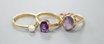 An 18ct gold and pearl ring, gross 2.6 grams, a pale amethyst and 9ct gold ring, gross 3.7 grams and