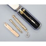 A 9ct gold toothpick, a 9ct gold mounted penknife (blades broken), a gold plated propelling pen