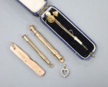 A 9ct gold toothpick, a 9ct gold mounted penknife (blades broken), a gold plated propelling pen