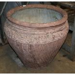A large incised terracotta garden urn, 64cm diameter, H.60cm
