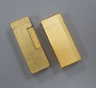 A gold plated Cartier lighter and a similar Dupont lighter