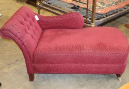 A Victorian style red upholstered buttoned back chaise longue, W.137cm