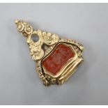 A Victorian yellow metal overlaid swivel triple gem set fob seal, with carved carnelian matrix,