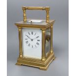 A brass cased repeating carriage clock, height with handle down 15cm