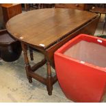 An 18th century oak gateleg table (re-tipped), W.122cm