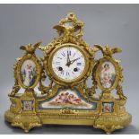 A French gilt bronze and Sevres-style porcelain mounted mantel clock.