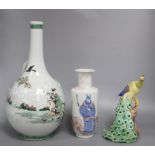 A Chinese famille verte bottle vase, an underglazed copper rouleau vase and a peacock, tallest 38cm