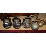 Six vintage cast metal kettle bell weights