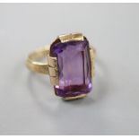 A 9ct gold and amethyst set dress ring, size K, gross 4.2 grams.CONDITION: Old repairs to the