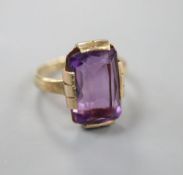 A 9ct gold and amethyst set dress ring, size K, gross 4.2 grams.CONDITION: Old repairs to the