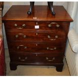 A George III mahogany commode, enclosed by a two section dummy drawer front, W.69cm