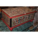 An Indonesian carved painted hardwood coffer, W.99cm, D.59cm, H.45cm