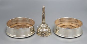 A pair of bottle coasters with beaded rims and turned hardwood bases, London 1991, width 14cm and