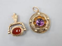 A Victorian yellow metal and cabochon amethyst set pendant, 20mm and a modern 9ct gold and gem set