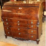 An early 19th century Dutch mahogany and chequer inlaid cylinder breakfront bureau, with fitted