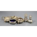 Two 20th century silver three piece condiment sets, including one by Lowe & Son.