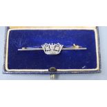 A 14ct, plat and diamond set coronet sweethearts bar brooch, 49mm, gross 3.7 grams, in Gieves box.