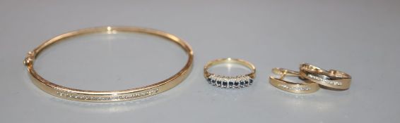 A modern 9ct gold sapphire and diamond ring, a modern 10k and diamond bangle and pair of matching,