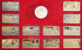 A cased set of twelve silver gilt 'The Churchill Years' ingots and a similar medallion, gross 21.