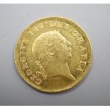 A George III gold half guinea, 1804, GVF.