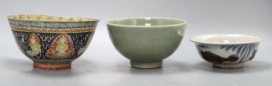 A Chinese celadon bowl, a Thai market famille rose bowl and a crackle glaze bowlCONDITION: The