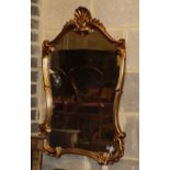 An 18th century style gilt framed cartouche shaped wall mirror, 58 x 86cm