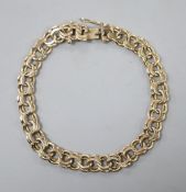 A yellow metal double link bracelet (tests as 9ct gold), 16.5 grams.