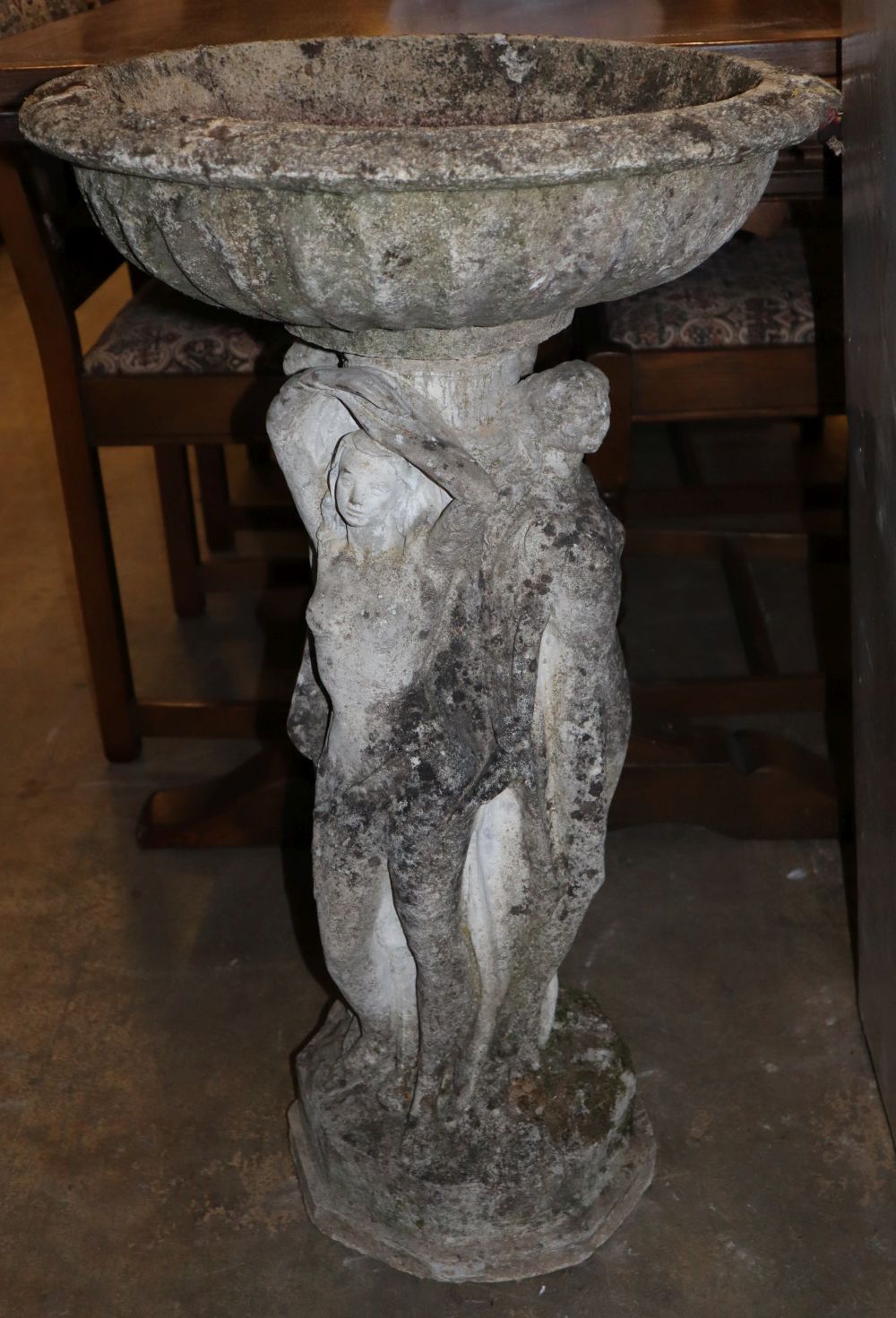 A reconstituted stone garden bird bath, 48cm diameter, H.80cm