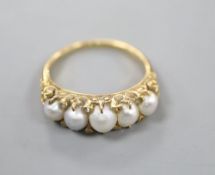 A Victorian yellow metal, graduated split pearl and diamond chip set half hoop ring, size R, gross