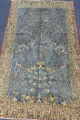 A Qum carpet, 254 x 156cmCONDITION: Slightly faded with wear to blue ground, no rips or tears