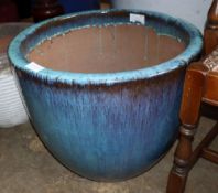 A large turquoise glazed garden planter, 57cm diameter