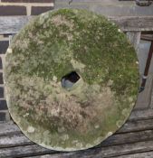 A natural stone millstone, diameter 58cm