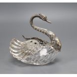 A cut glass pot pourri, in the form of a swan with embossed silver head and pierced hinged wings,