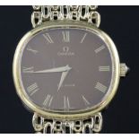 A gentleman's 1970's silver gilt Omega de Ville manual wind wristwatch, on Omega oval link bracelet,