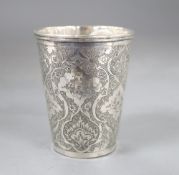 A Persian engraved white metal beaker, 71mm, 100 grams.