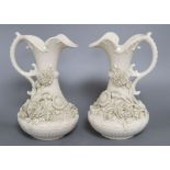 A pair of Belleek ewers, second period, height 23cm