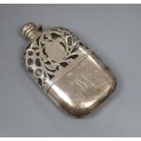 A white metal overlaid glass hip flask, with white metal cup and engraved monogram, 16.7cm.