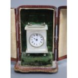 An early 20th century white metal mounted mother of pearl miniature timepiece, marked to base