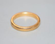 A 22ct wedding band, size L/M, 5.5 grams.