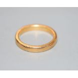 A 22ct wedding band, size L/M, 5.5 grams.