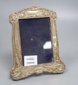 An Edwardian Art Nouveau silver mounted photograph frame, Birmingham, 1904, 21.5cm.