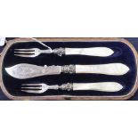 A silver and mother of pearl-handled three-piece butter/pickle set, Birmingham 1864, maker George