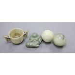 Four Chinese hardstone carvings, one of a gent, a cup and two balls