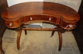 A mahogany kidney shaped dressing table, W.102cm D.55cm H.70cm