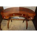 A mahogany kidney shaped dressing table, W.102cm D.55cm H.70cm