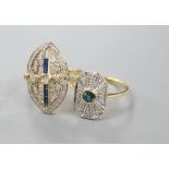 Two modern 18ct gold, sapphire and diamond set dress rings, (three stones missing from one), sizes M
