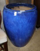 A large blue glazed garden planter, 48cm diameter