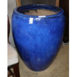 A large blue glazed garden planter, 48cm diameter