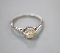 A white metal (stamped platinum) and diamond solitaire ring, size L, gross 2.4 grams.CONDITION: